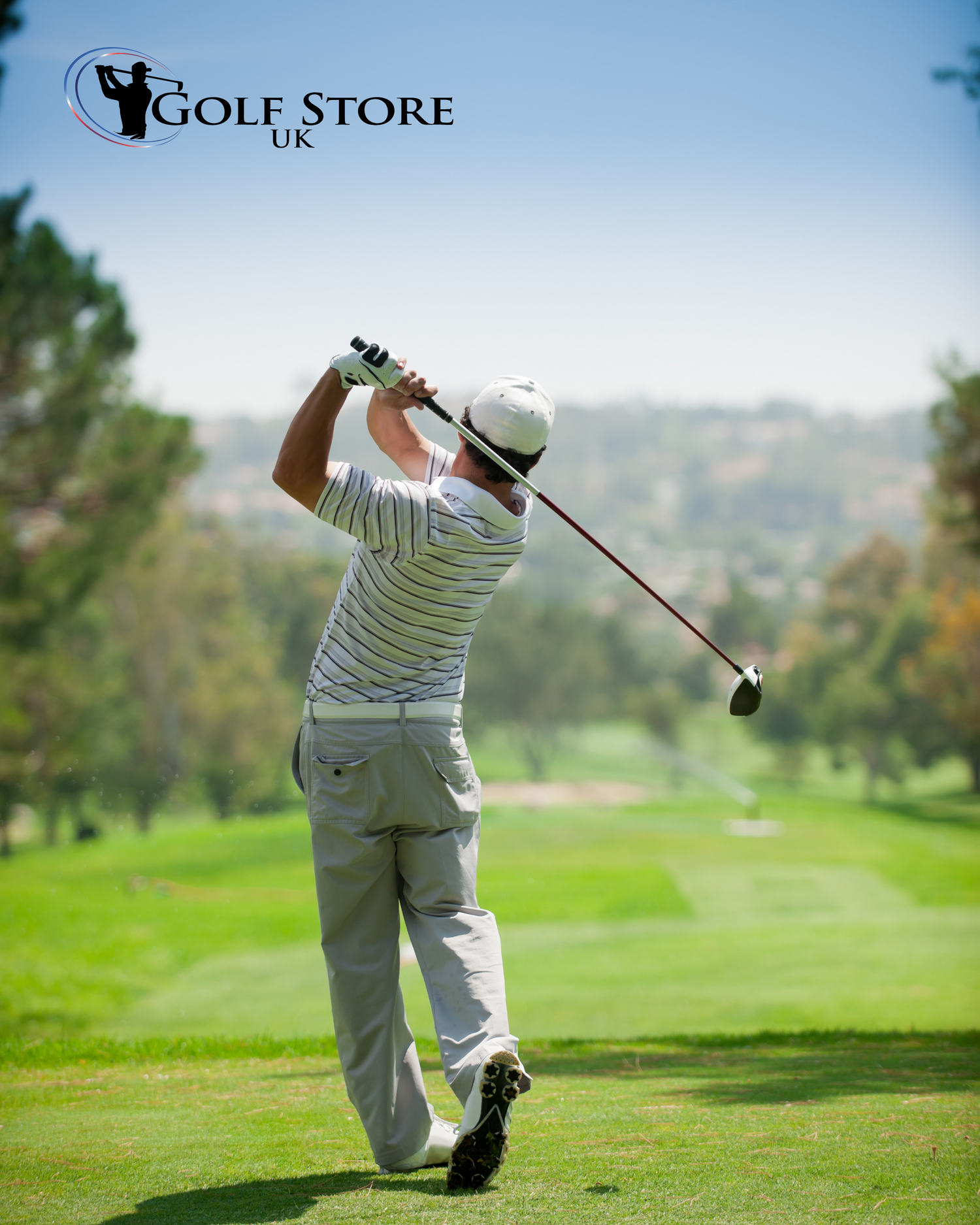 A man drives a golf ball down the fairway