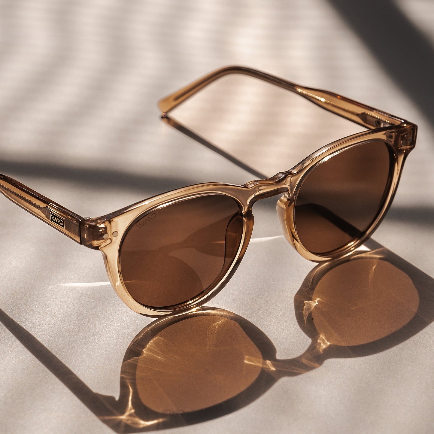 TATE Retro Round Unisex Sunglasses in Light Crystal Brown by WMP Eyewear