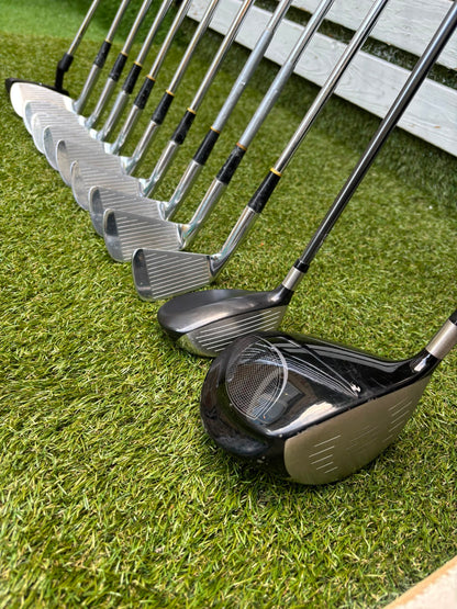 Wilson 3–SW Irons, TaylorMade Driver, Cleveland Fairway, Slazenger Putter & Titleist Cart Bag