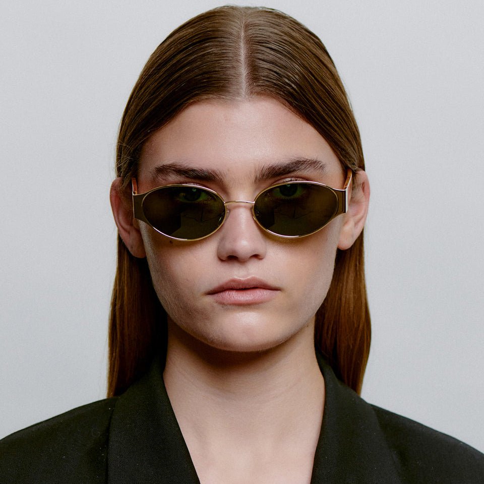 A.KJÆRBEDE BELLA Oval Sunglasses -  Gold Metal Frame / Burn Amber Temples